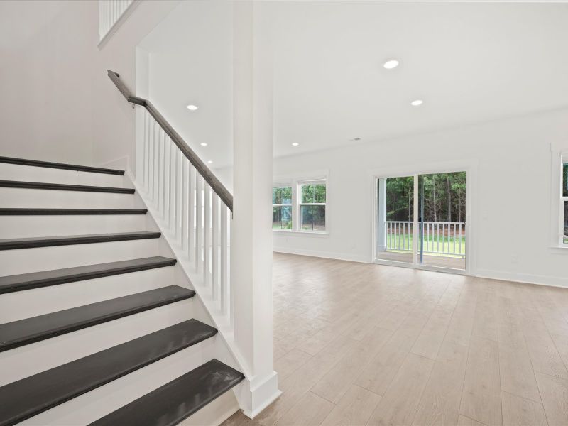 Spacious, unfurnished interior of a new home in The Coves at Lakes of Cane Bay, Summerville (Image 19).