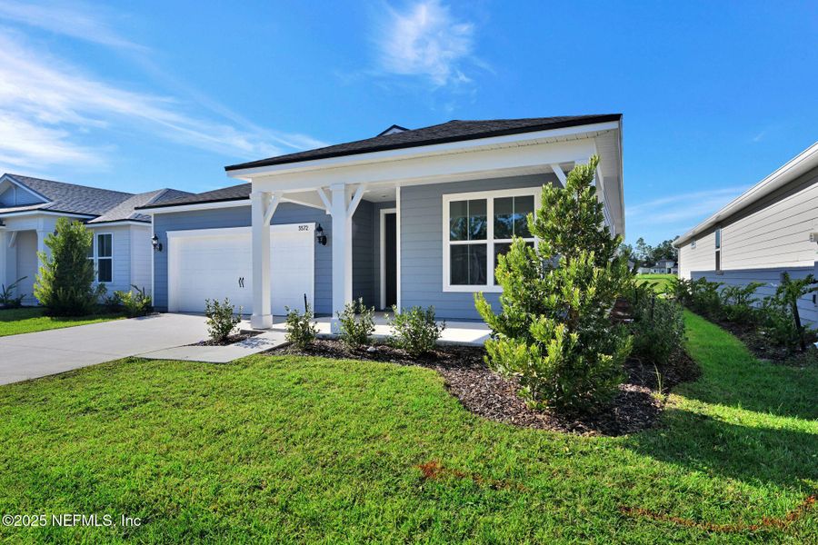 Front exterior of a new home in Hyland Trail, Green Cove Springs, FL, highlighting curb appeal (Image 17). Front exterior of a new home in Hyland Trail, Green Cove Springs, FL, highlighting curb appeal (Image 17).