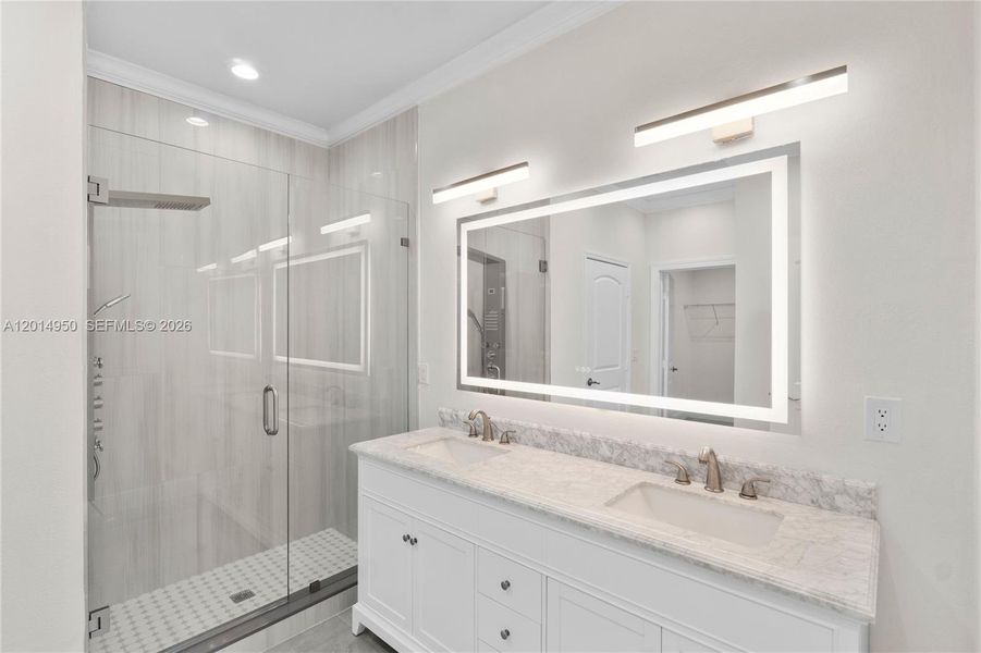 Primary bathroom with vanity and modern finishes