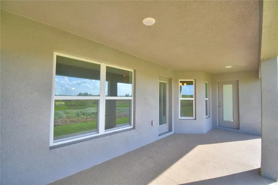 Exterior details and patio area of a home in Cadence Crossing, Auburndale (Image 25).