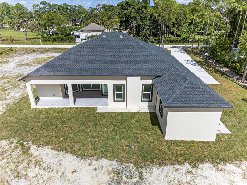 Front exterior of a new home in , The Acreage, FL, highlighting curb appeal (Image 25). Front exterior of a new home in , The Acreage, FL, highlighting curb appeal (Image 25).