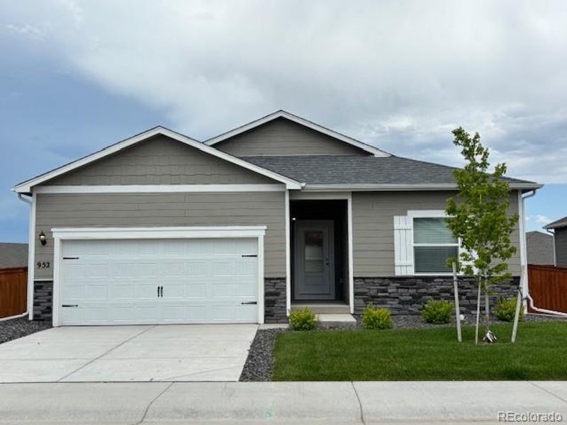 Front exterior of a new home in Hidden Valley Farm, Severance, CO, highlighting curb appeal (Image 2). Front exterior of a new home in Hidden Valley Farm, Severance, CO, highlighting curb appeal (Image 2).