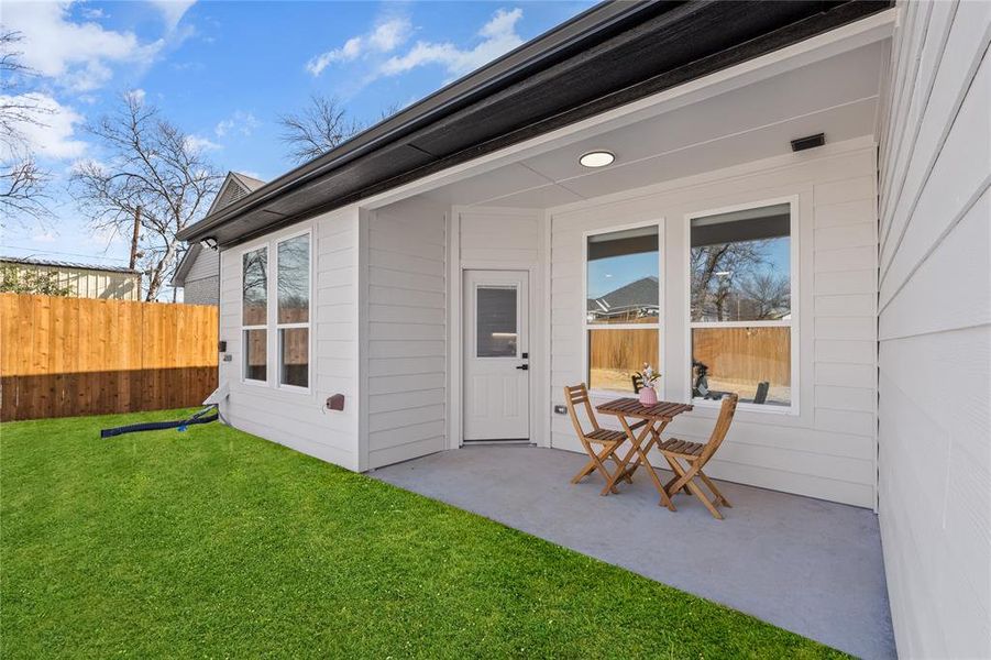 Entrance to property featuring a patio area and outdoor dining area Entrance to property featuring a patio area and outdoor dining area
