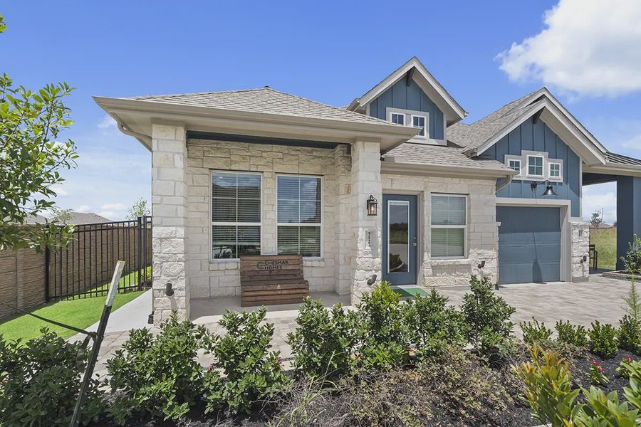 Representative exterior photo of a completed home built from the Carriagehouse by Chesmar Homes in Meridiana Townhomes, Iowa Colony, TX (Image 21). Representative exterior photo of a completed home built from the Carriagehouse by Chesmar Homes in Meridiana Townhomes, Iowa Colony, TX (Image 21).