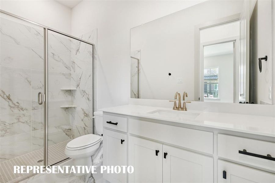 Friends and family will feel right at home in either of the beautifully finished guest baths in our Bella plan.  REPRESENTATIVE PHOTO