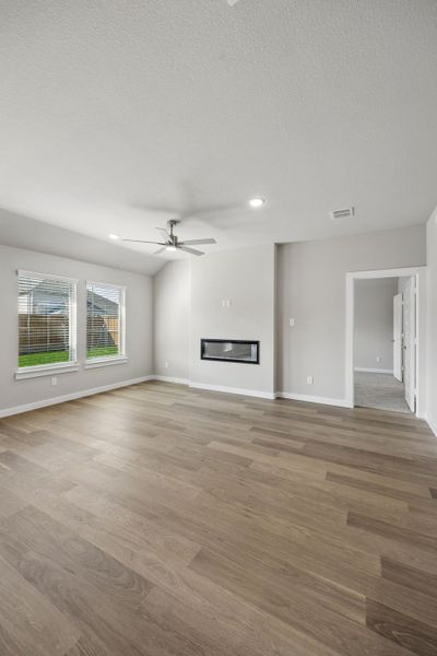 Living Room in the Emmy II home plan by Trophy Signature Homes - REPRESENTATIVE PHOTO