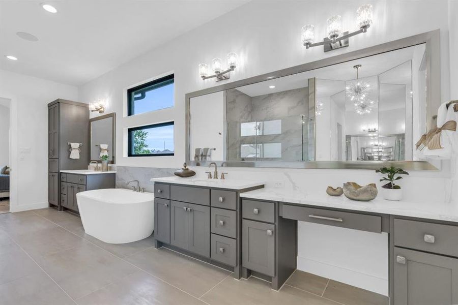 The impressive primary bath with linen storage, large vanities, make-up space and a 3 view mirror.