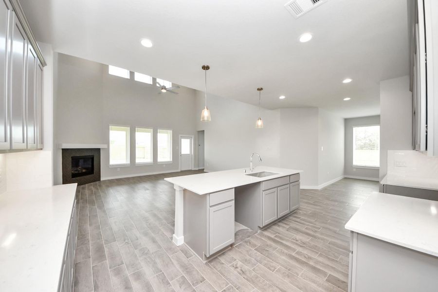 All this opens up to the expansive family room, creating a perfect hub for gatherings. Sample photo of completed home with similar floor plan. Actual colors and selections may vary. All this opens up to the expansive family room, creating a perfect hub for gatherings. Sample photo of completed home with similar floor plan. Actual colors and selections may vary.