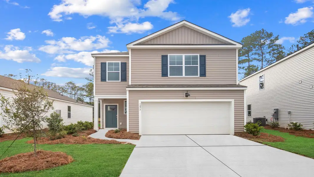 Front exterior of a new home in The Retreat at East Argent, Ridgeland, SC, highlighting curb appeal (Image 1). Front exterior of a new home in The Retreat at East Argent, Ridgeland, SC, highlighting curb appeal (Image 1).