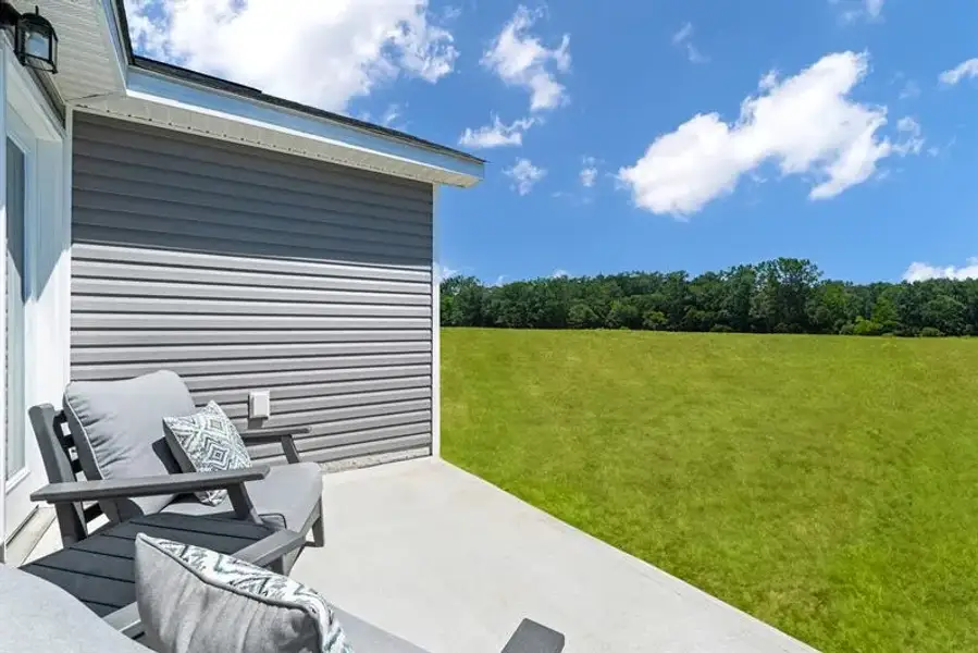 Exterior details and patio area of a home in Reidville Villas, Reidville (Image 2).
