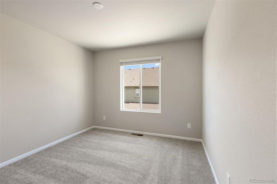 Spacious, unfurnished interior of a new home in Woodrose at Painted Prairie, Aurora (Image 22).