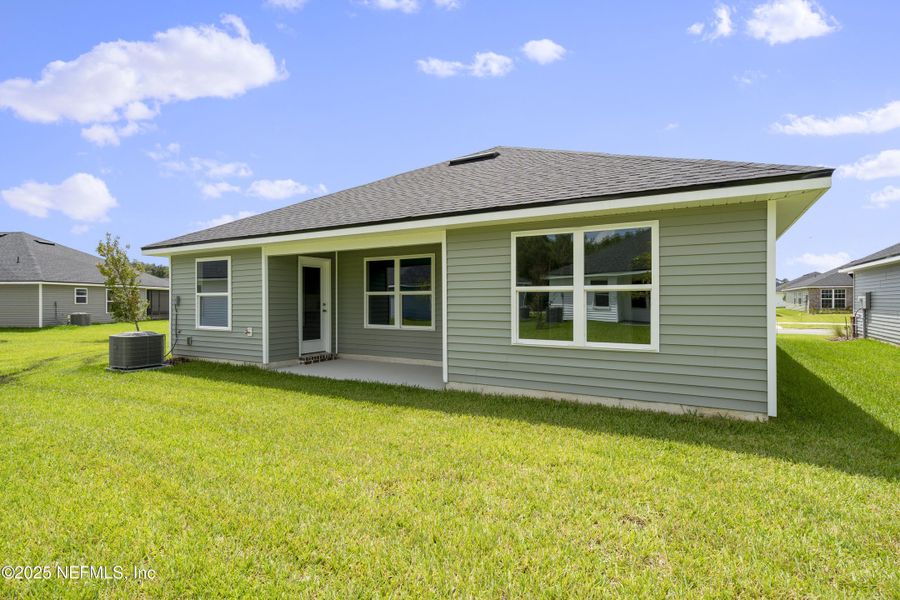Front exterior of a new home in Summerglen, Jacksonville, FL, highlighting curb appeal (Image 14). Front exterior of a new home in Summerglen, Jacksonville, FL, highlighting curb appeal (Image 14).