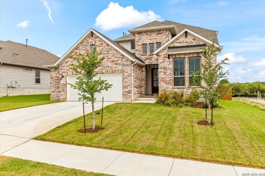 Front exterior of a new home in Foxbrook, Cibolo, TX, highlighting curb appeal (Image 21).