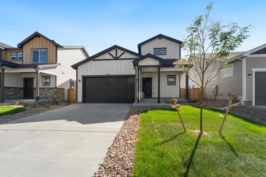 Front exterior of a new home in Granary, Johnstown, CO, highlighting curb appeal (Image 1). Front exterior of a new home in Granary, Johnstown, CO, highlighting curb appeal (Image 1).