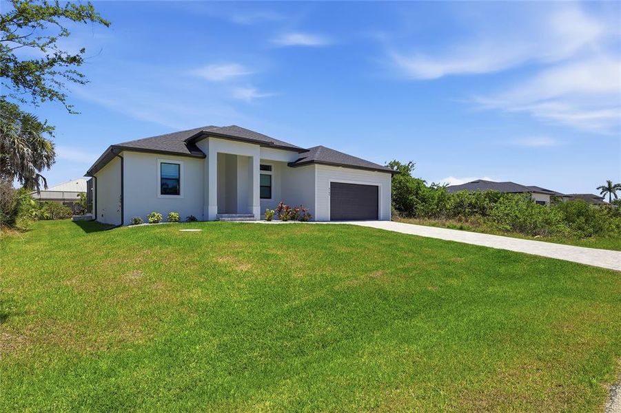 Front exterior of a new home in , Port Charlotte, FL, highlighting curb appeal (Image 24).