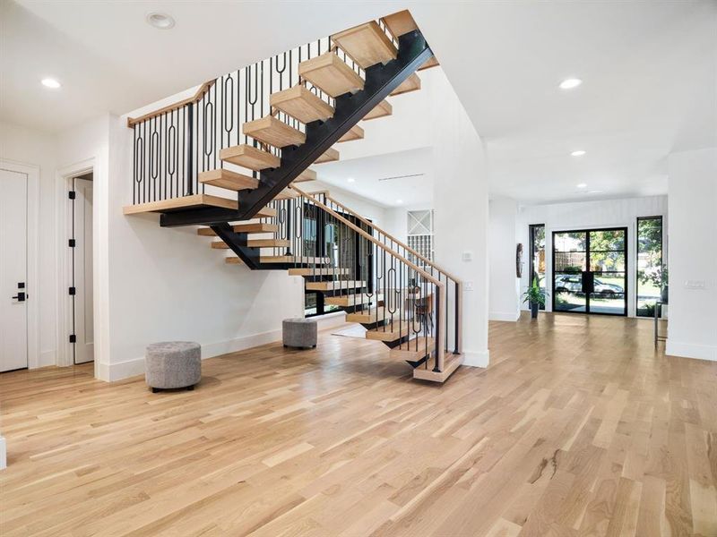 Staircase featuring recessed lighting and wood finished floors