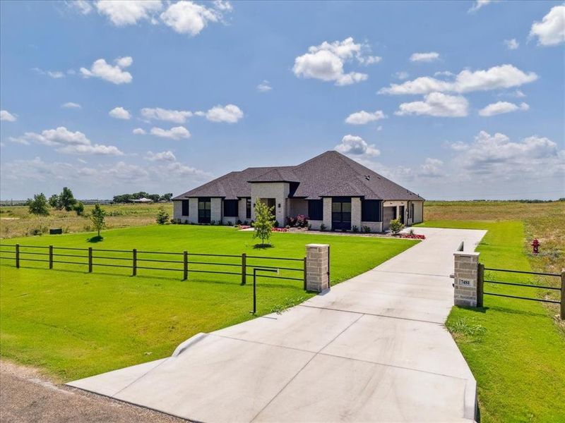 Front exterior of a new home in Coppenger Place, Godley, TX, highlighting curb appeal (Image 25). Front exterior of a new home in Coppenger Place, Godley, TX, highlighting curb appeal (Image 25).