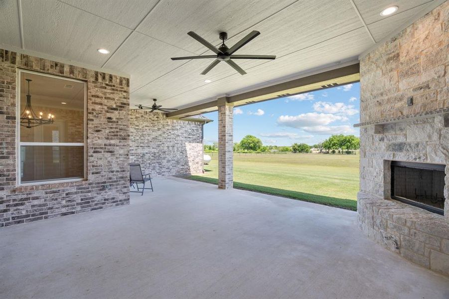 Great Covered, Open Patio Space with Ceiling Fan & Fireplace