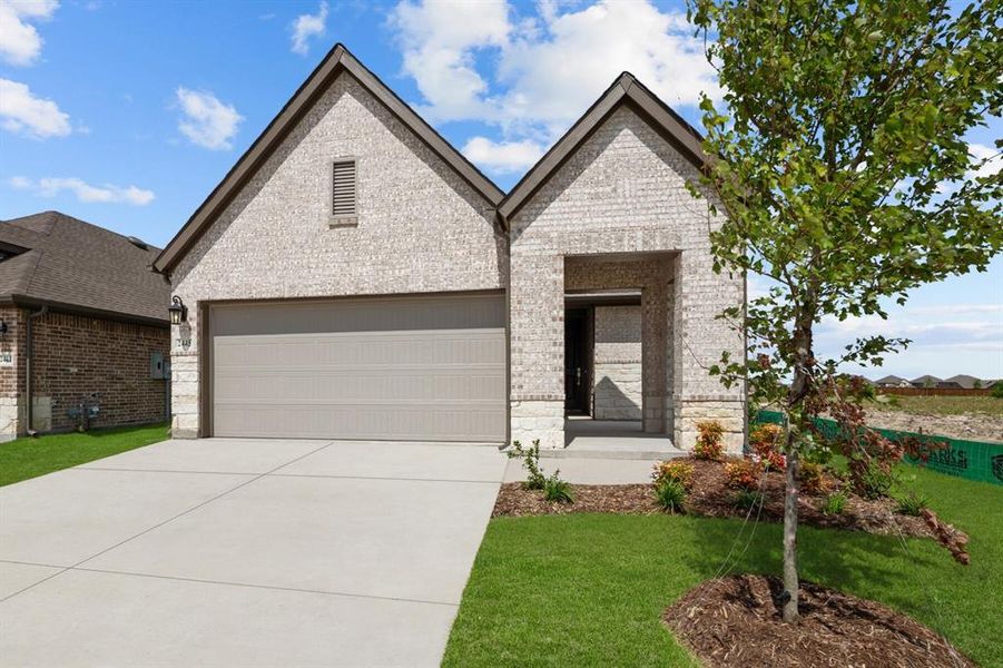 Front exterior of a new home in Creekshaw – Gardens, Royse City, TX, highlighting curb appeal (Image 2). Front exterior of a new home in Creekshaw – Gardens, Royse City, TX, highlighting curb appeal (Image 2).