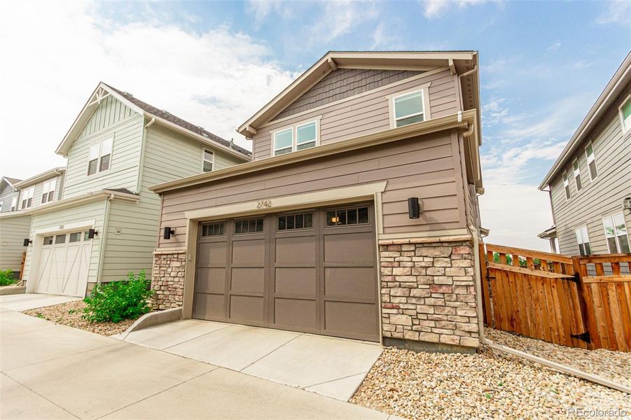 Front exterior of a new home in Arras Park, Thornton, CO, highlighting curb appeal (Image 1).