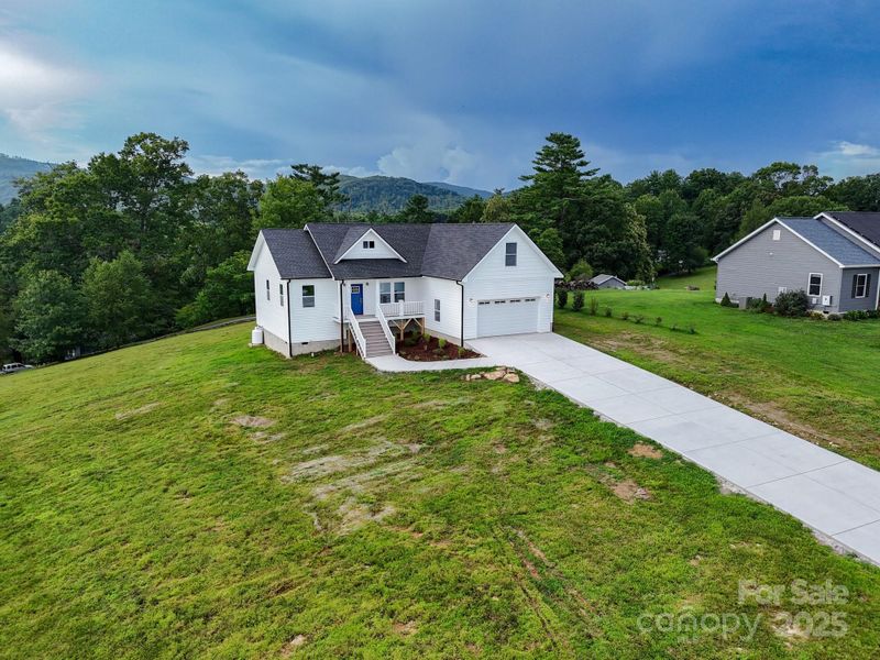 Front exterior of a new home in , Hendersonville, NC, highlighting curb appeal (Image 25). Front exterior of a new home in , Hendersonville, NC, highlighting curb appeal (Image 25).