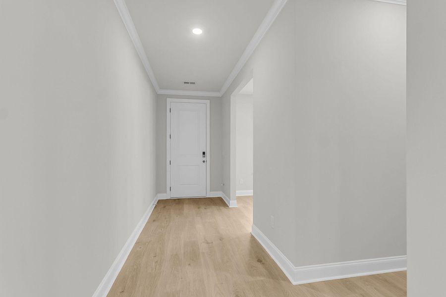 Spacious, unfurnished interior of a new home in Tidewater at Lakes of Cane Bay, Summerville (Image 32).