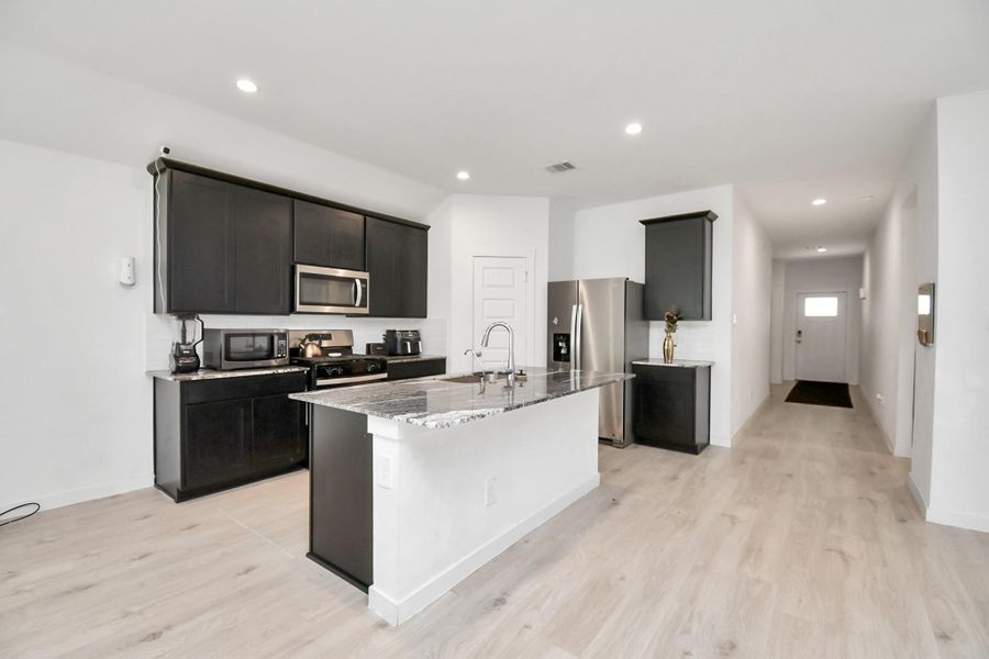 Furnished interior view inside a new home in Post Oak Pointe, Fresno (Image 7).