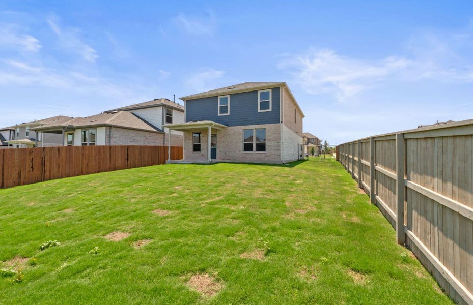 Front exterior of a new home in Saddleback at Santa Rita Ranch, Liberty Hill, TX, highlighting curb appeal (Image 19).