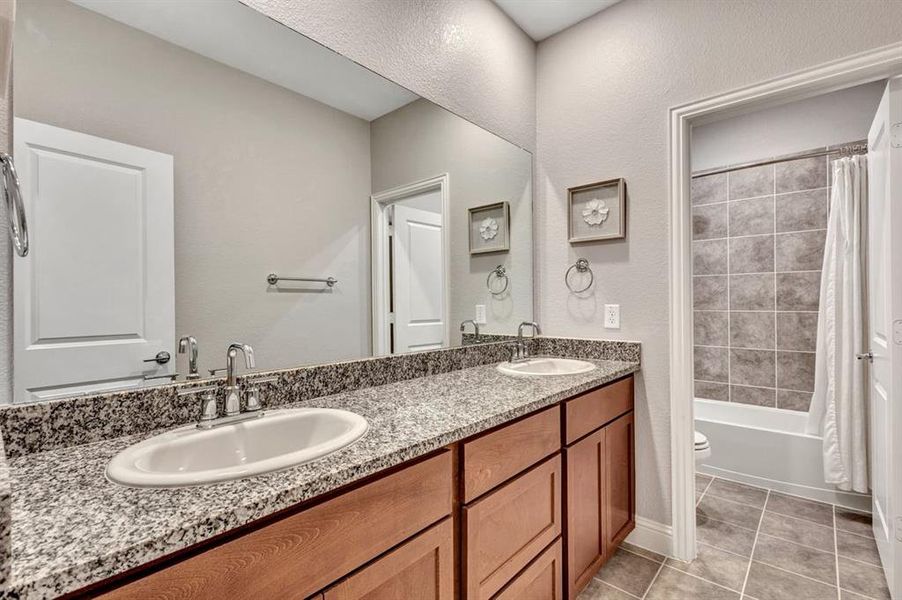 Bathroom conveniently located by the 2nd and 3rd bedrooms.
