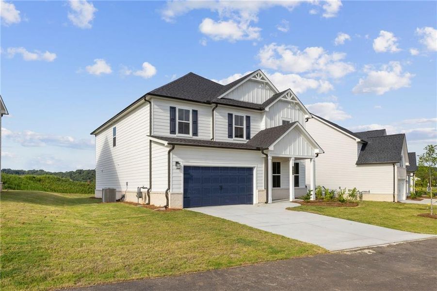 Front exterior of a new home in The Estates at Gainesville Township, Gainesville, GA, highlighting curb appeal (Image 1).