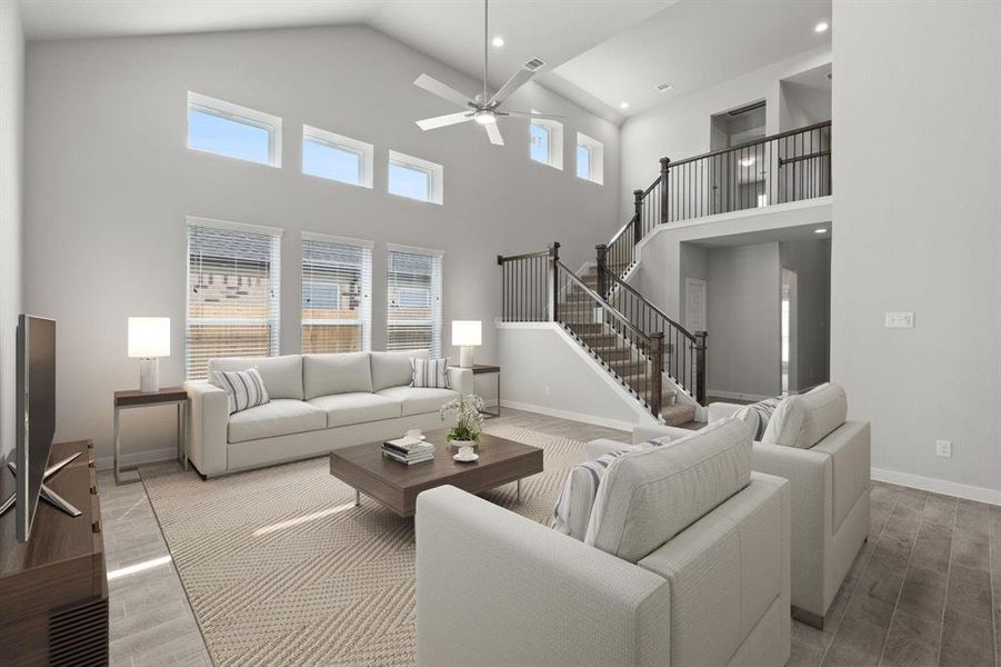 Take another glimpse into the heart of the home with this additional view of the family room—a sprawling space ready to accommodate all your gatherings. Sample photo of completed home with similar floor plan. As-built interior colors and selections may vary.