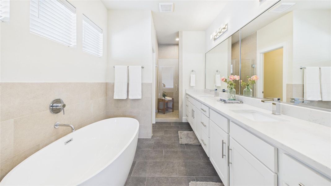 Soaking tub, double sinks, private water closet and walk-in shower. Soaking tub, double sinks, private water closet and walk-in shower.