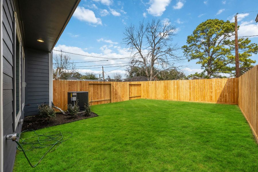 A right-sized green space—perfect for pets, grilling, or just soaking up some sun. This low-maintenance yard gives you space without the hassle.