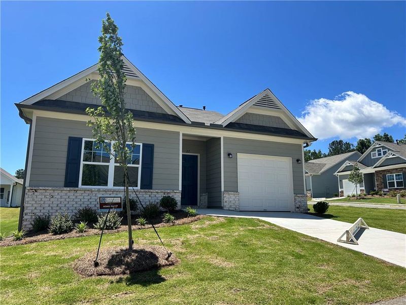 Front exterior of a new home in Villages at Cedar Hill, Dallas, GA, highlighting curb appeal (Image 24). Front exterior of a new home in Villages at Cedar Hill, Dallas, GA, highlighting curb appeal (Image 24).