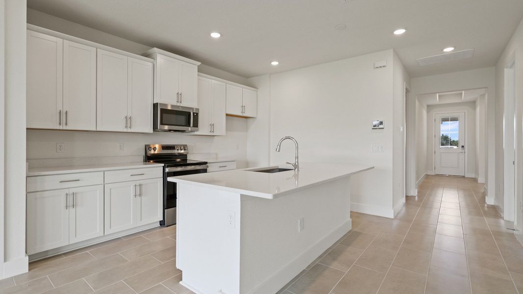 Kitchen in the Buttonwood floorplan by DRB Homes at Lakeside at Satilla in Saint Cloud, FL