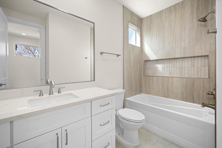 Third Bathroom with quartz countertop  and  shower tub combination.