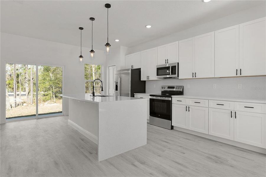 Stainless steel appliances and plenty of cabinet space