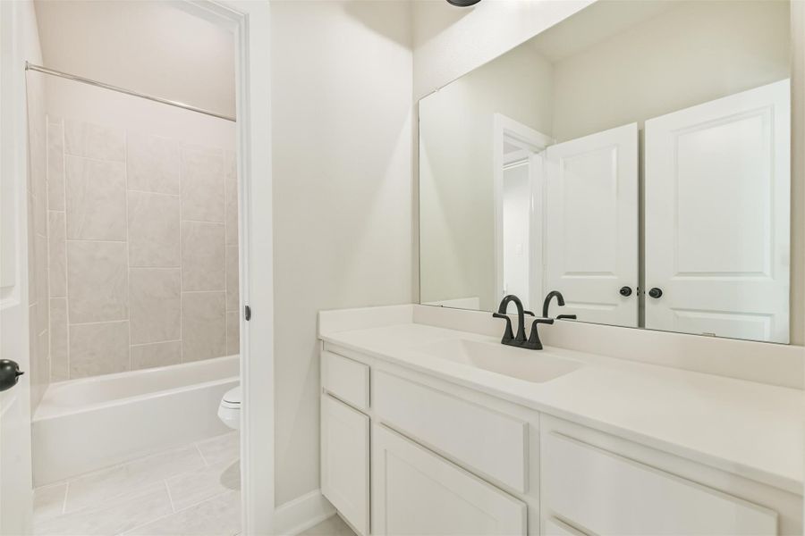 Furnished interior view inside a new home in The Woodlands Hills – 55', Willis (Image 16).