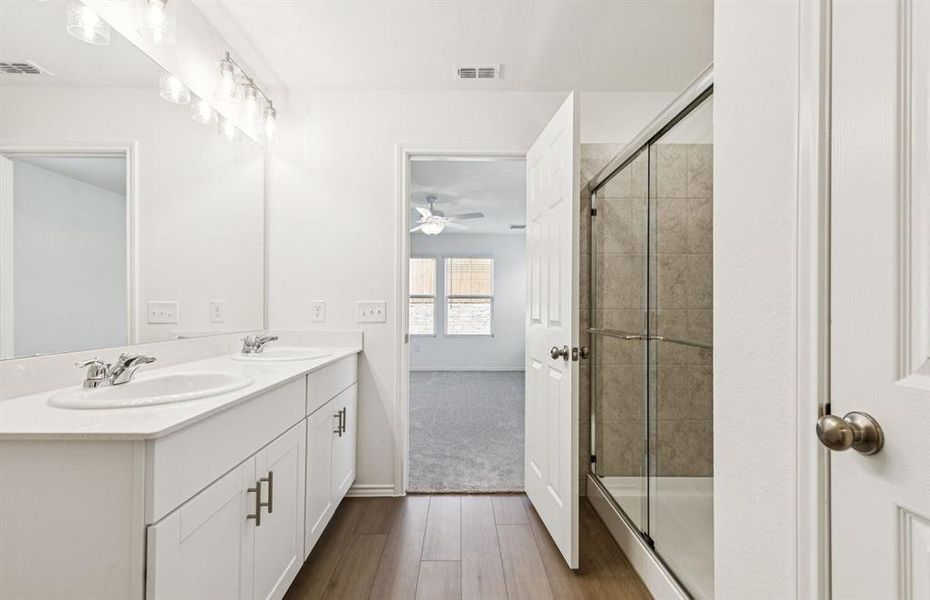 Elegant owner's suite with oversized shower