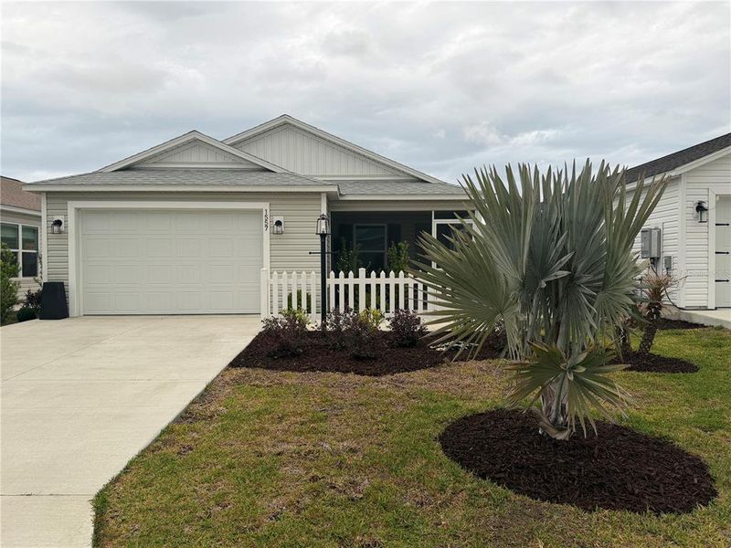 Front exterior of a new home in , The Villages, FL, highlighting curb appeal (Image 2). Front exterior of a new home in , The Villages, FL, highlighting curb appeal (Image 2).