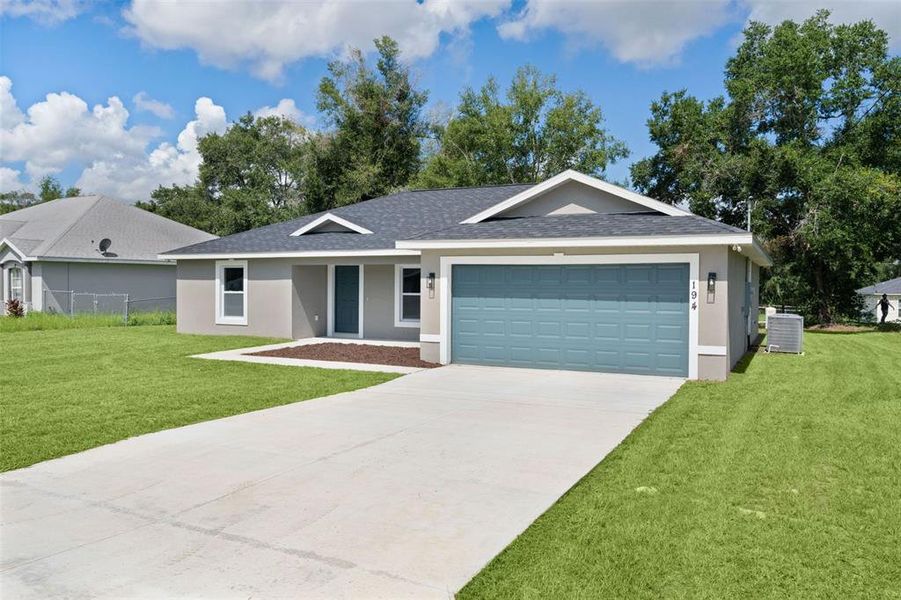 Front exterior of a new home in , Ocklawaha, FL, highlighting curb appeal (Image 18).