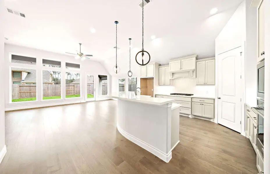 Representative furnished interior of a home built from the 2406 by Ravenna Homes in The Highlands 55′, Porter (Image 6).