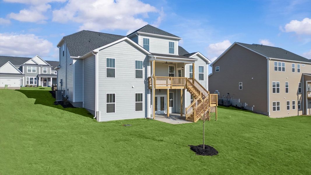 Warm and inviting outdoor living space with a covered rear porch and tasteful finishes