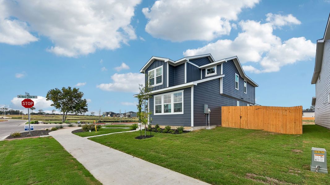 Front exterior of a new home in Valverde, Bastrop, TX, highlighting curb appeal (Image 24). Front exterior of a new home in Valverde, Bastrop, TX, highlighting curb appeal (Image 24).