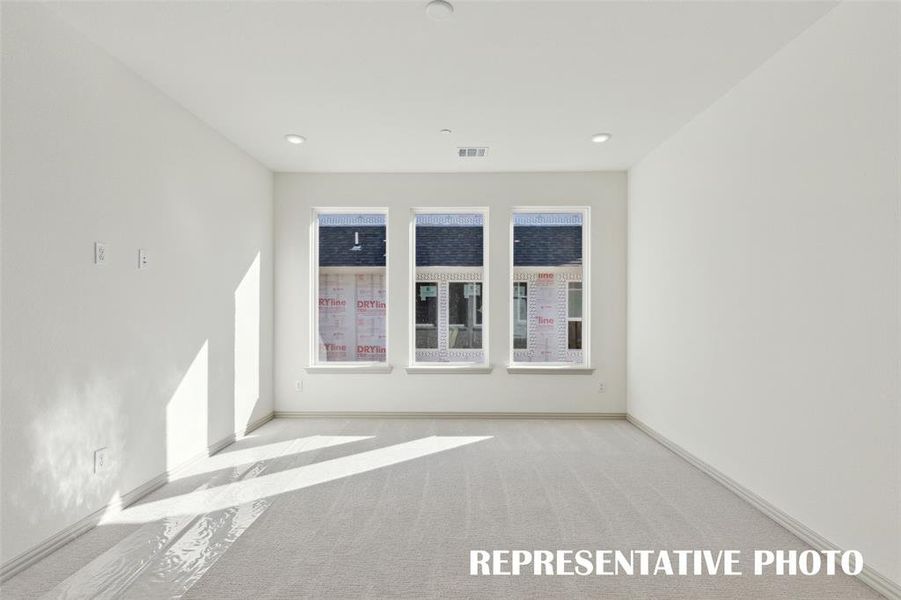 Plenty of family fun time to be enjoyed in this light filled game room!  REPRESENTATIVE PHOTO