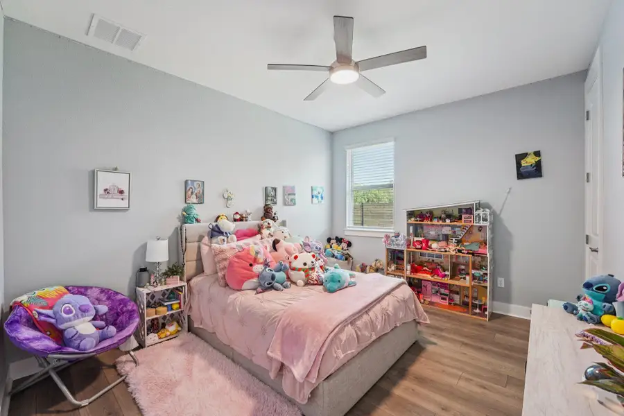 Each guest bedroom offers generous space and natural light, creating a comfortable and welcoming retreat.