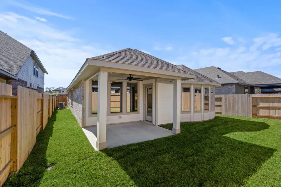 Exterior details and patio area of a home in Grand Central Park, Conroe (Image 4).