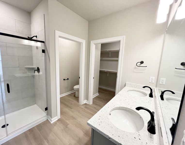 Front exterior of a new home in Emberly, Beasley, TX, highlighting curb appeal (Image 14).