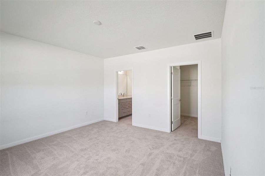 Spacious, unfurnished interior of a new home in Grasslands West, Lakeland (Image 27).