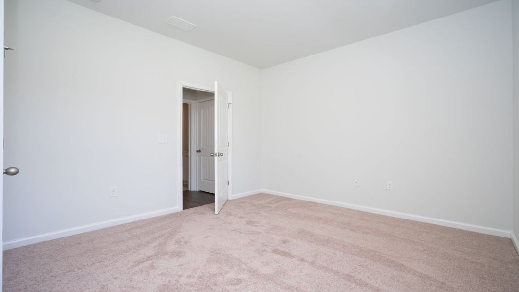 Representative unfurnished interior of a home built from the ROBIE by D.R. Horton in Indigo Preserve, Leland (Image 20).